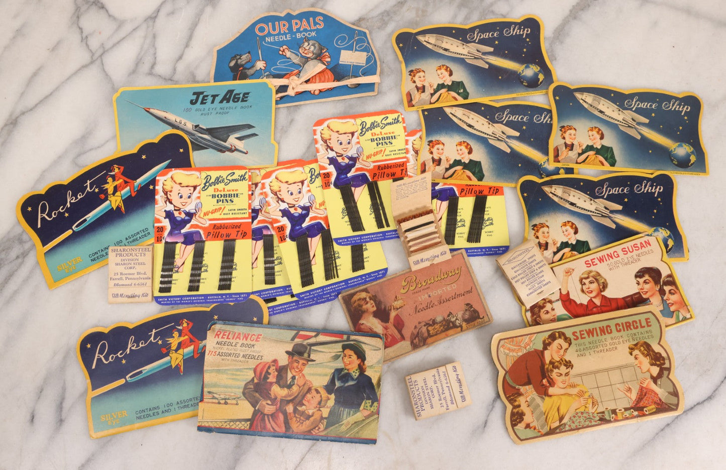 Lot 212 - Vintage Grouping Of 20+ Sewing Needle & Notions Card Lot Including Space Ship & Rocket Brand Needle Folders, Bobbie Smith Bobbie Pins, And Other Vintage Sewing Cards
