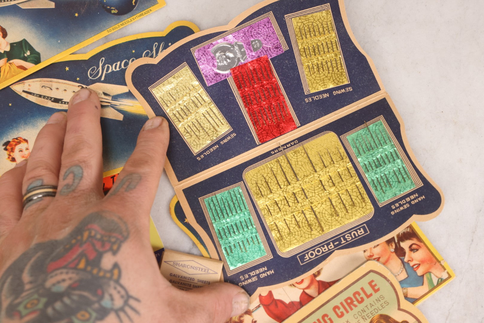 Lot 212 - Vintage Grouping Of 20+ Sewing Needle & Notions Card Lot Including Space Ship & Rocket Brand Needle Folders, Bobbie Smith Bobbie Pins, And Other Vintage Sewing Cards