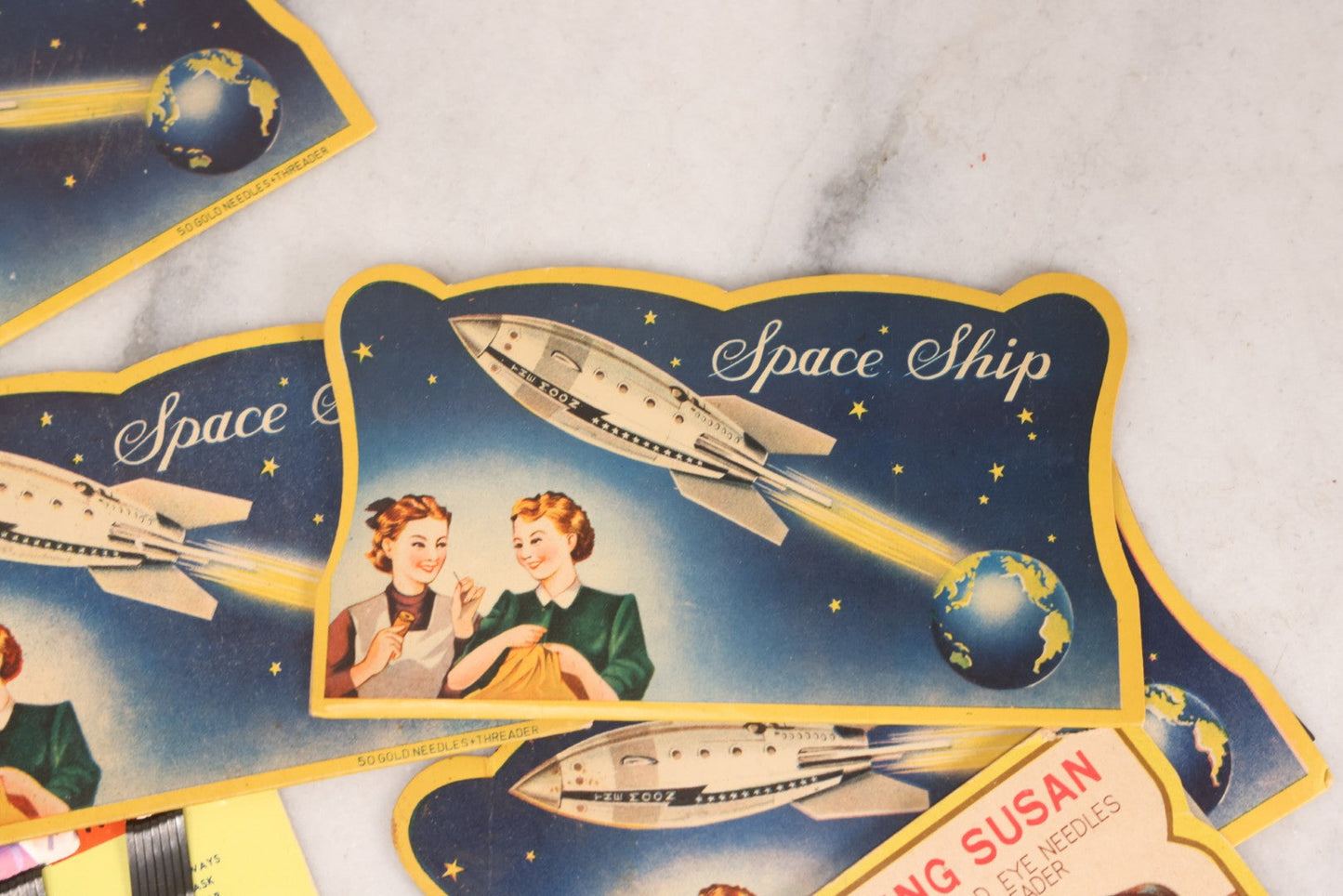Lot 212 - Vintage Grouping Of 20+ Sewing Needle & Notions Card Lot Including Space Ship & Rocket Brand Needle Folders, Bobbie Smith Bobbie Pins, And Other Vintage Sewing Cards