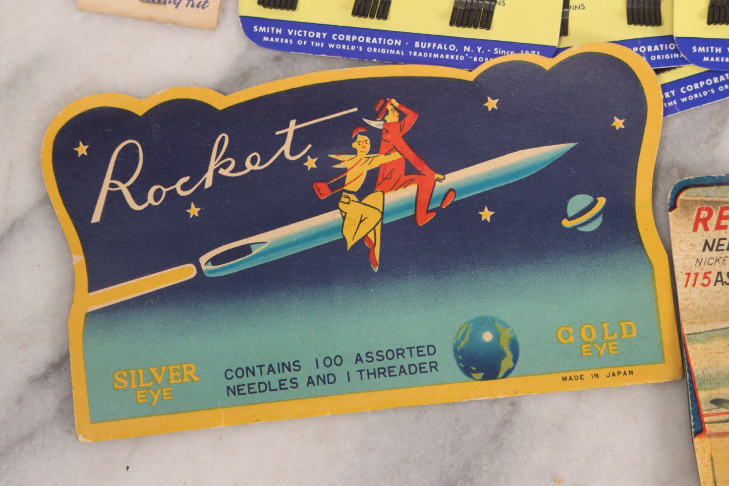 Lot 212 - Vintage Grouping Of 20+ Sewing Needle & Notions Card Lot Including Space Ship & Rocket Brand Needle Folders, Bobbie Smith Bobbie Pins, And Other Vintage Sewing Cards