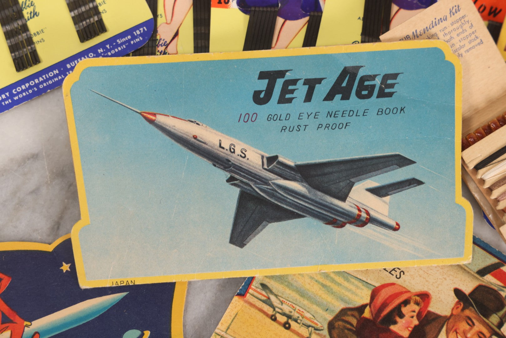 Lot 212 - Vintage Grouping Of 20+ Sewing Needle & Notions Card Lot Including Space Ship & Rocket Brand Needle Folders, Bobbie Smith Bobbie Pins, And Other Vintage Sewing Cards