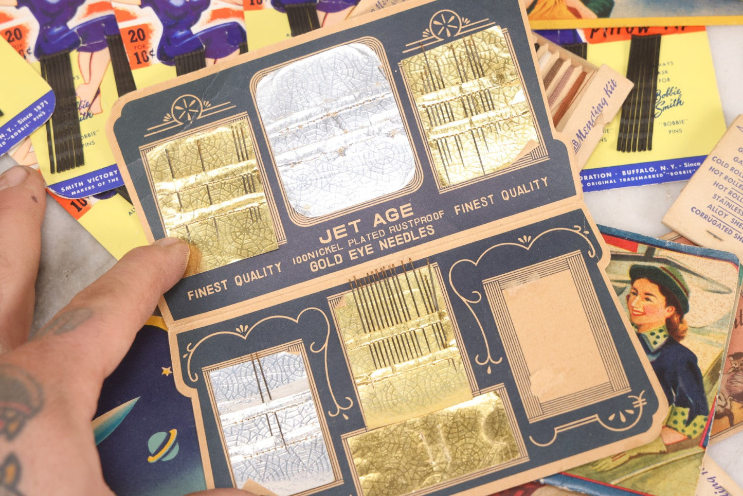Lot 212 - Vintage Grouping Of 20+ Sewing Needle & Notions Card Lot Including Space Ship & Rocket Brand Needle Folders, Bobbie Smith Bobbie Pins, And Other Vintage Sewing Cards