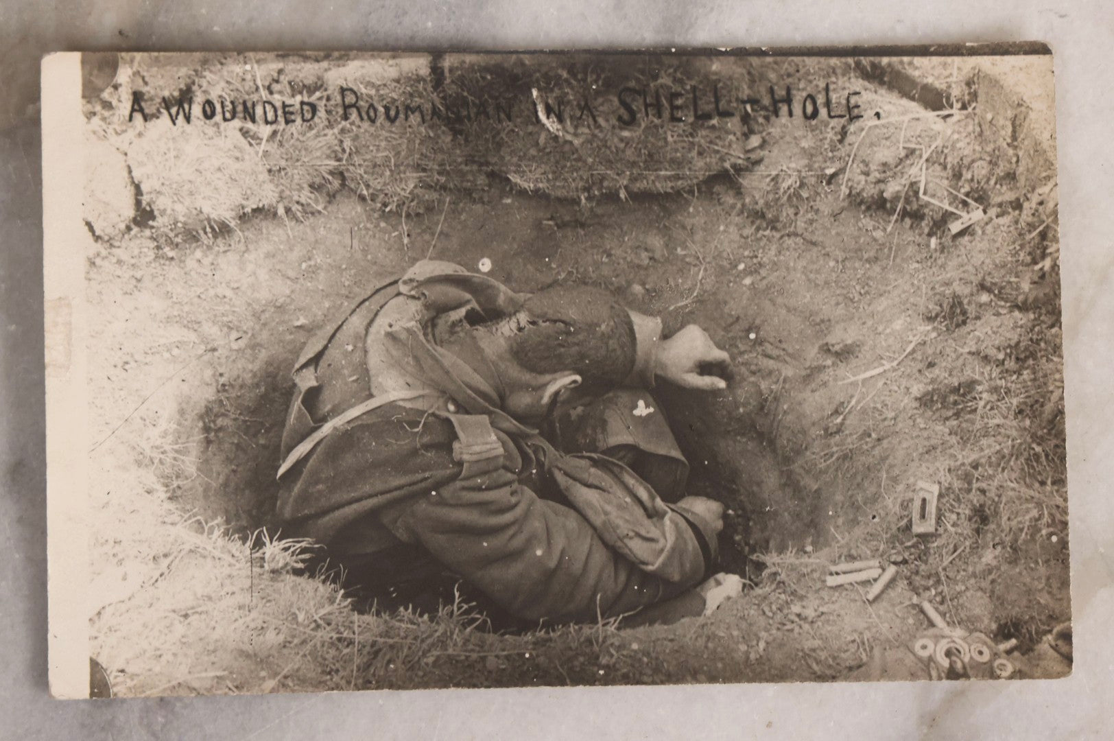 Lot 223 - Antique Real Photo Postcard R.P.P.C.. “A Wounded Romanian In A Shell-Hole,” World War I Era, Circa 1916–1918
