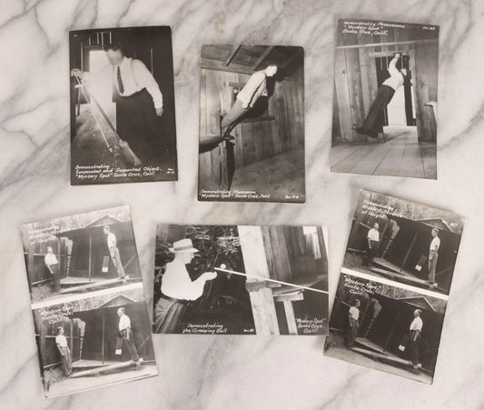 Lot 228 - Grouping Of Six Vintage Souvenir Photo Postcards Depicting Demonstrated Phenomena At The Mystery Spot, Santa Cruz, California