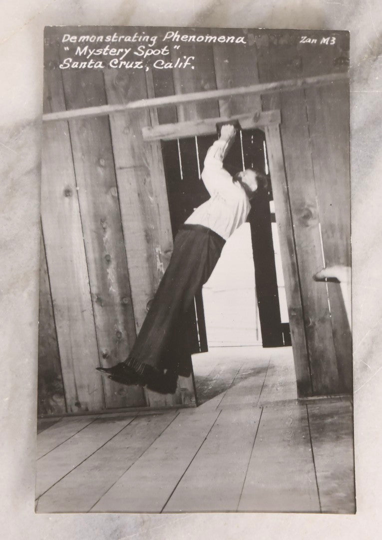 Lot 228 - Grouping Of Six Vintage Souvenir Photo Postcards Depicting Demonstrated Phenomena At The Mystery Spot, Santa Cruz, California