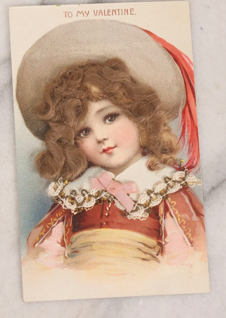 Lot 236 - Grouping Of Nine Antique Valentine And Holiday Postcards, Including One With Real Hair Applied, Paper Lace, Gilt Accents, And Thanksgiving Card Depicting Jack-O-Lantern J.O.L. Carving