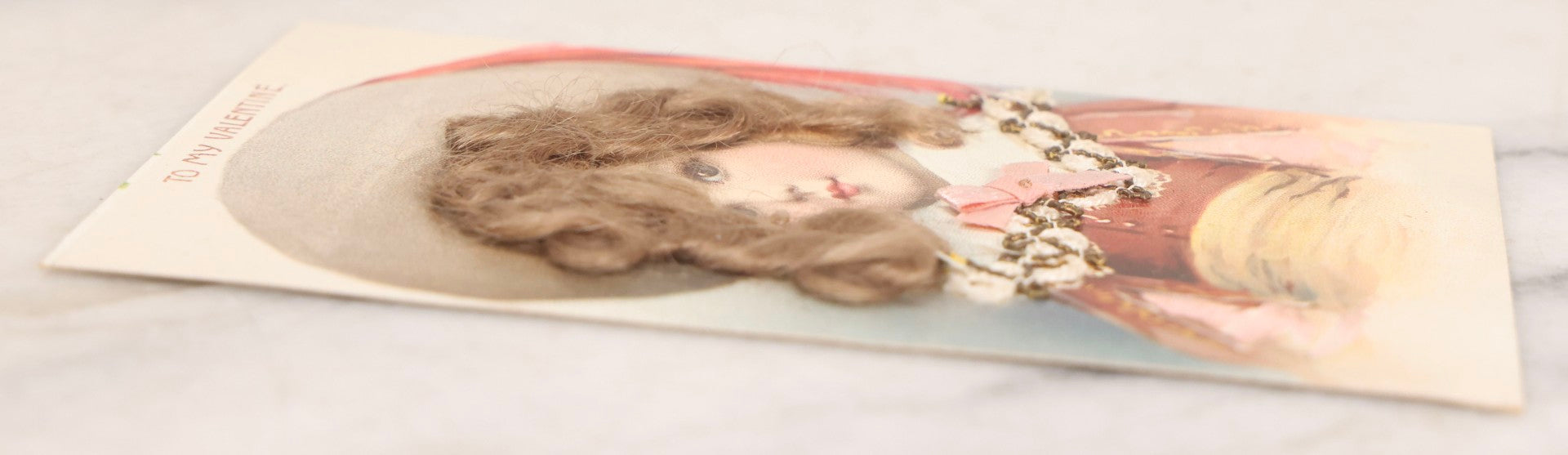 Lot 236 - Grouping Of Nine Antique Valentine And Holiday Postcards, Including One With Real Hair Applied, Paper Lace, Gilt Accents, And Thanksgiving Card Depicting Jack-O-Lantern J.O.L. Carving