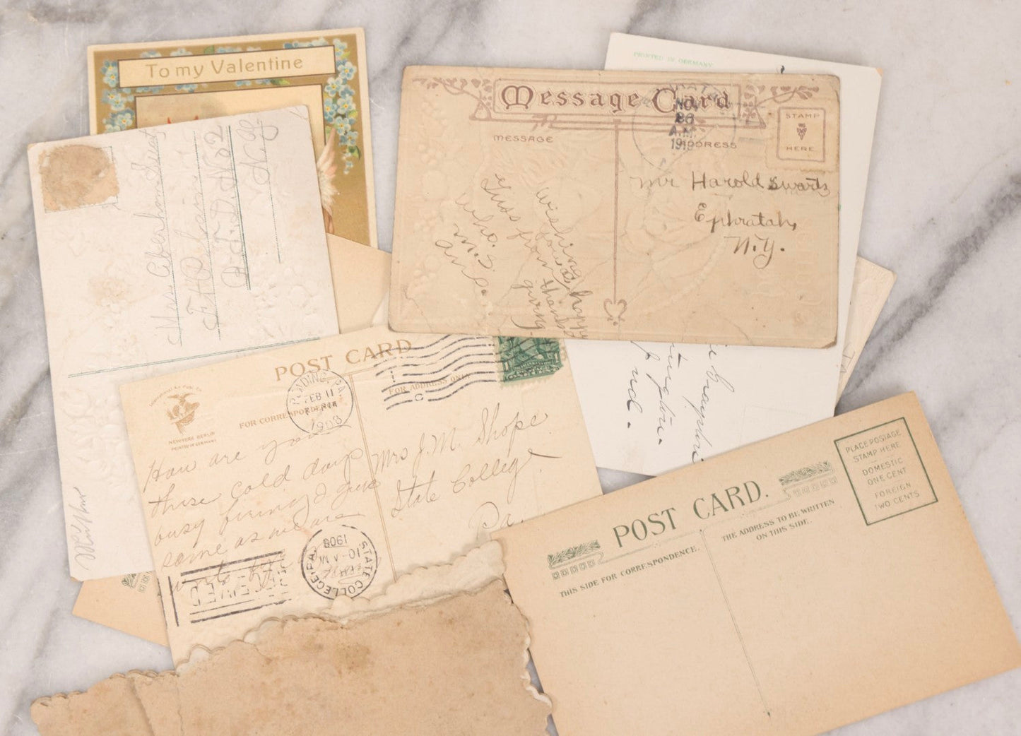 Lot 236 - Grouping Of Nine Antique Valentine And Holiday Postcards, Including One With Real Hair Applied, Paper Lace, Gilt Accents, And Thanksgiving Card Depicting Jack-O-Lantern J.O.L. Carving