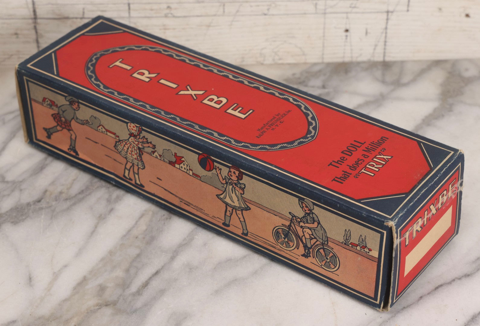 Lot 261 - Vintage Trixbe Doll Advertising Box, “The Doll That Does A Million 'Trix',” Ralph A. Freundlich Inc., New York City, Lithographed Cardboard Packaging, Children Playing Graphics