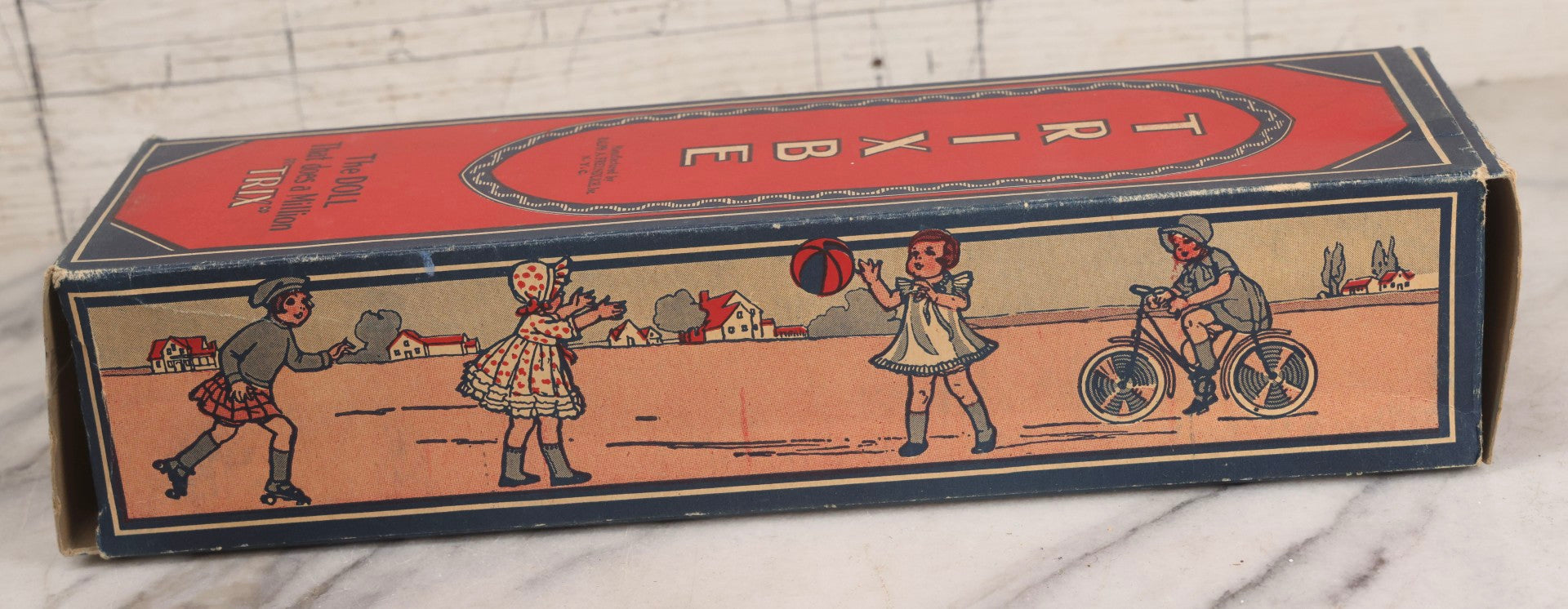 Lot 261 - Vintage Trixbe Doll Advertising Box, “The Doll That Does A Million 'Trix',” Ralph A. Freundlich Inc., New York City, Lithographed Cardboard Packaging, Children Playing Graphics