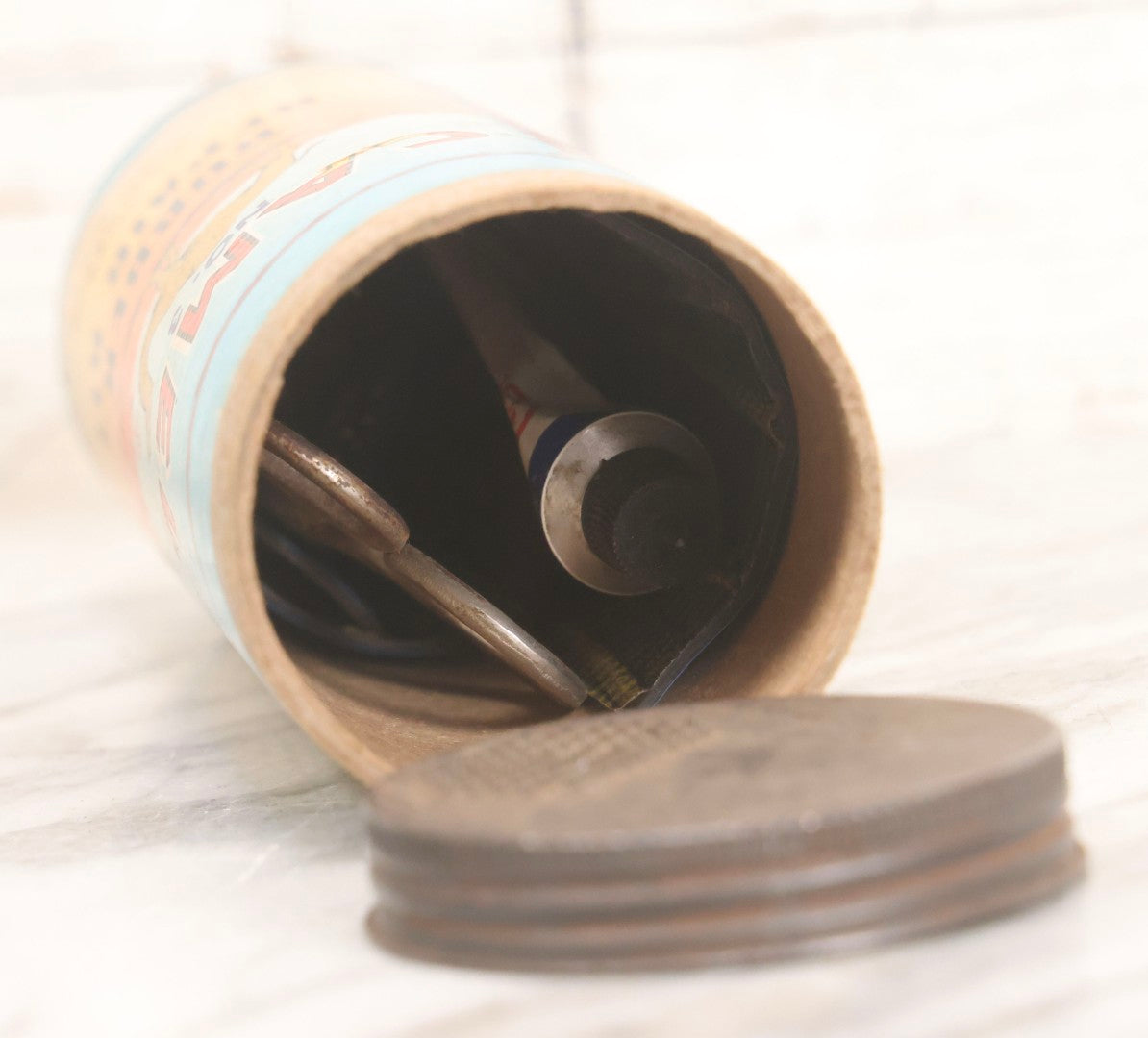 Lot 262 - Trio Of Vintage And Antique Advertising Pieces Including Grass Seed Tin, Camel Tire Tube Repair Kit, And “Little General Infants Durable Hose” Undergarments Box, W.T. Grant Co., 1923