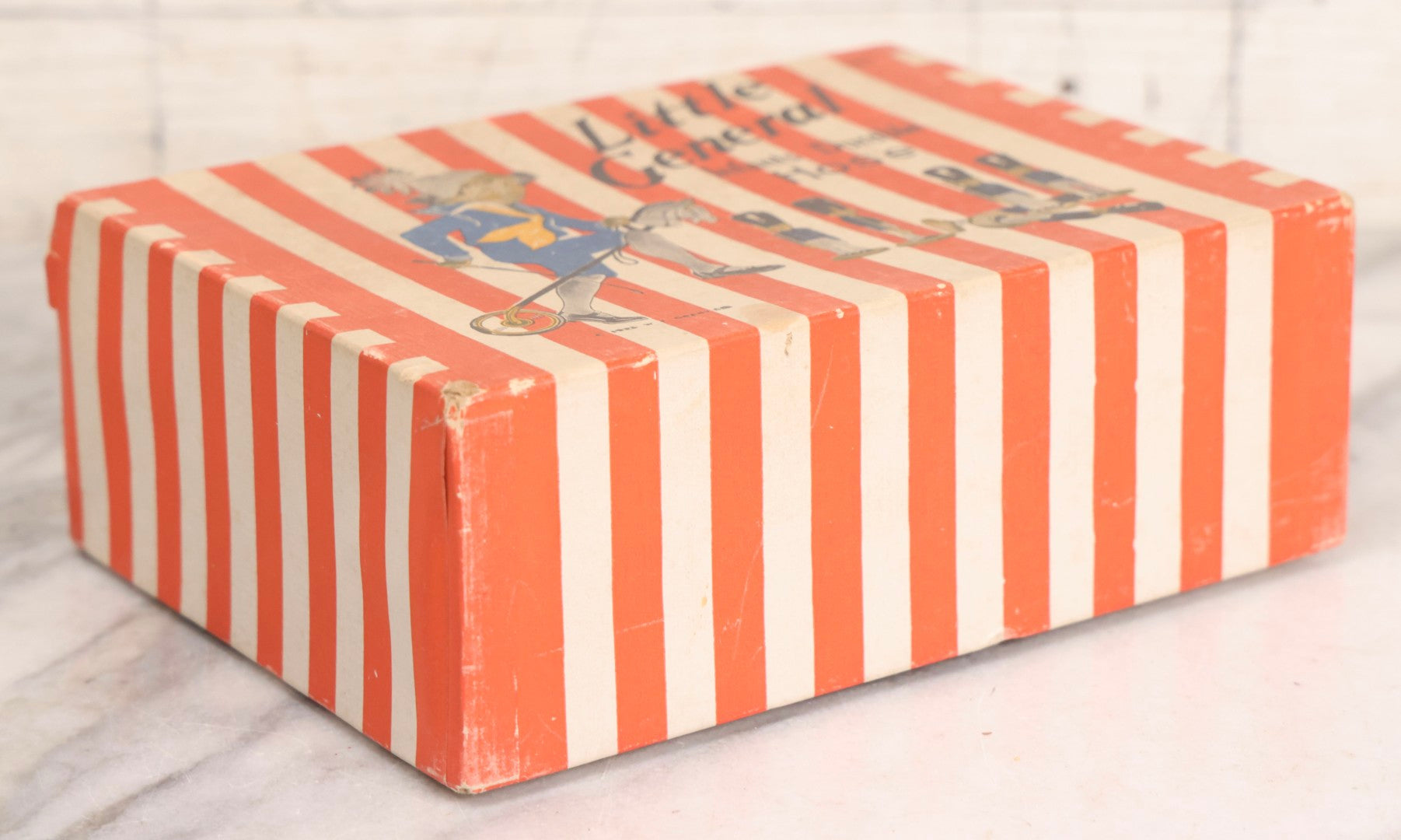 Lot 262 - Trio Of Vintage And Antique Advertising Pieces Including Grass Seed Tin, Camel Tire Tube Repair Kit, And “Little General Infants Durable Hose” Undergarments Box, W.T. Grant Co., 1923