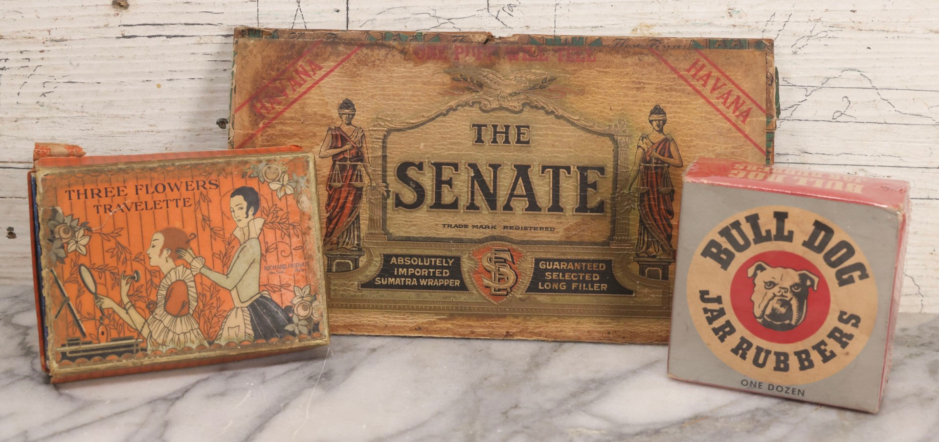 Lot 268 - Trio Of Vintage And Antique Advertising Boxes Including Bull Dog Jar Rubbers, Senate Havana Cigar, And Richard Hudnut “Three Flowers” Travelette Box