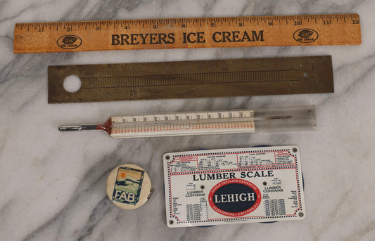 Lot 271 - Grouping Of Five Vintage Advertising Rulers, Thermometers, And Measuring Tools Including Breyers Ice Cream, Lehigh Portland Cement Co., Colgate's Fab, Railway Signal Association, And Conray Products Co. Inc. Navy Thermometer Fragment