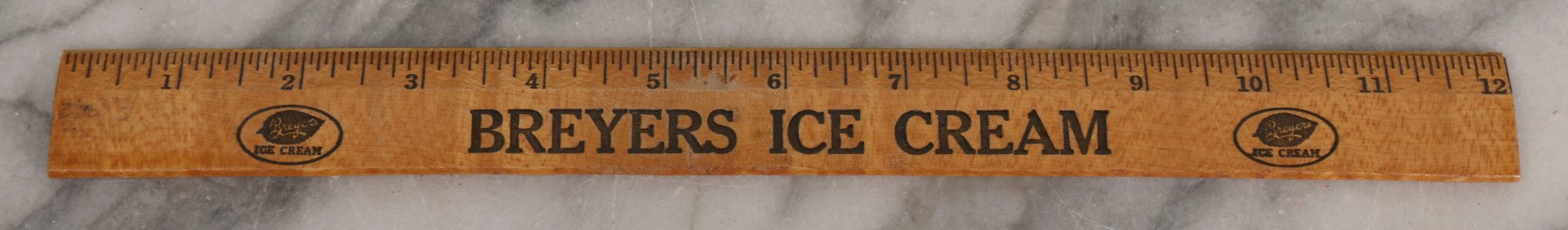 Lot 271 - Grouping Of Five Vintage Advertising Rulers, Thermometers, And Measuring Tools Including Breyers Ice Cream, Lehigh Portland Cement Co., Colgate's Fab, Railway Signal Association, And Conray Products Co. Inc. Navy Thermometer Fragment
