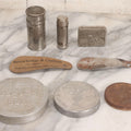 Lot 272 - Grouping Of Nine Vintage Advertising Objects Including Match Safe, Lion Brand Toothpaste Tin, Pet Milk Can Opener, U.S. Tobacco Co. Lid, And Shoe Horns From Strawbridge & Clothier And Sears Roebuck And Co.