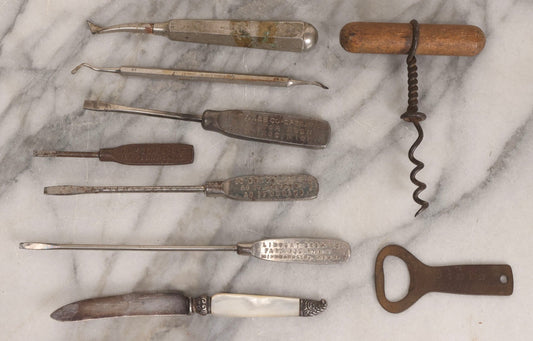 Lot 273 - Grouping Of Nine Vintage Metal Tools And Advertising Pieces Including Screwdrivers From Hastings Co-Operative Elevator, Dayton Scale, Lindsay Bros. Co., And Hoover, Dental Tools, Piel's Beer Opener, And Corkscrew
