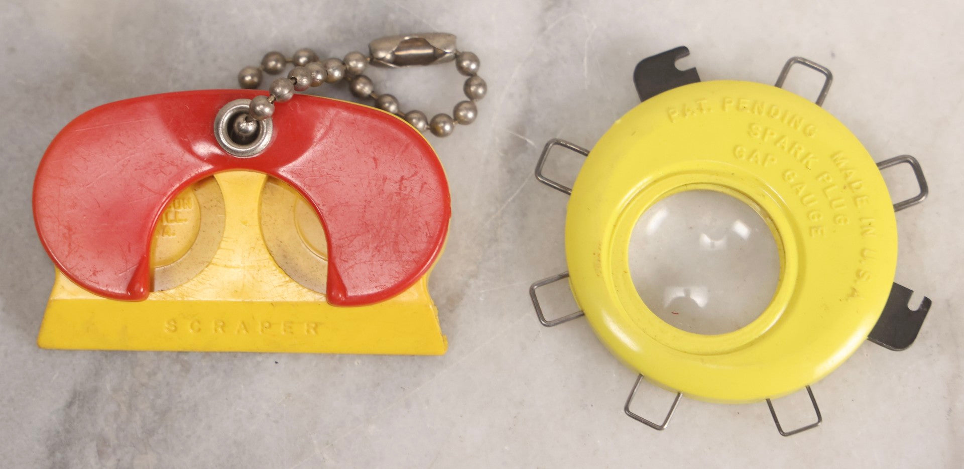 Lot 274 - Grouping Of 13 Vintage Advertising And Metal Pieces Including Ford And Studebaker Keys, Sutter's Hi Speed Turtle Bottle Opener, Acme Thunderer Whistles, S.S. Kresge Co. Feeler Gauge, And Shell Service Scraper