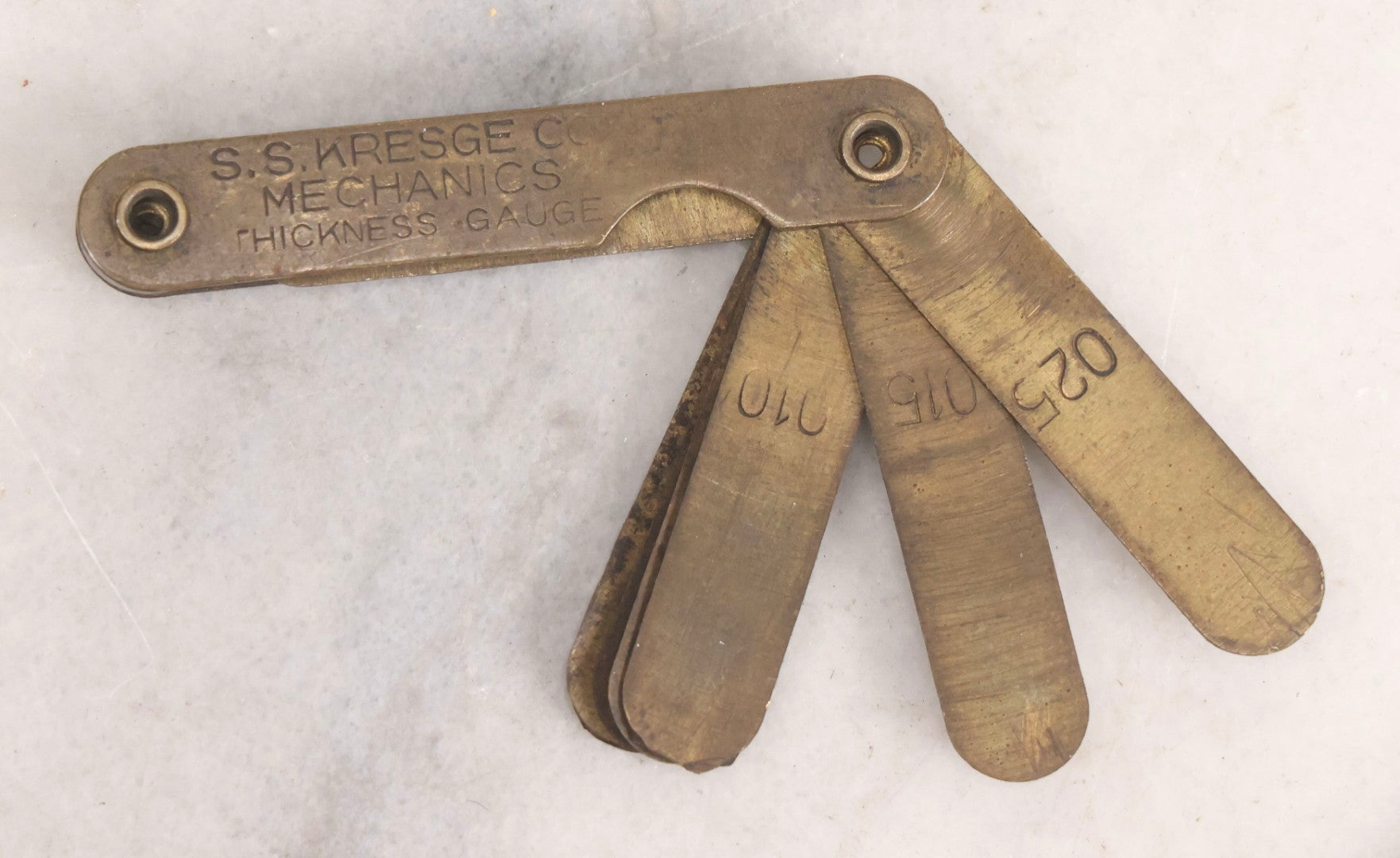 Lot 274 - Grouping Of 13 Vintage Advertising And Metal Pieces Including Ford And Studebaker Keys, Sutter's Hi Speed Turtle Bottle Opener, Acme Thunderer Whistles, S.S. Kresge Co. Feeler Gauge, And Shell Service Scraper