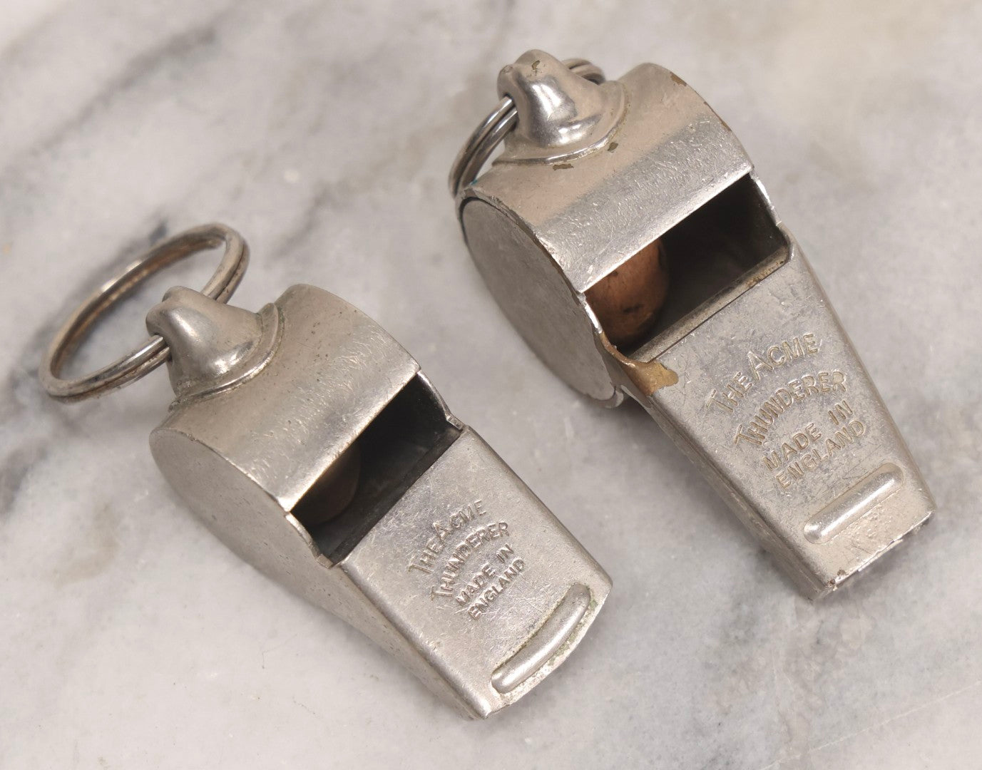 Lot 274 - Grouping Of 13 Vintage Advertising And Metal Pieces Including Ford And Studebaker Keys, Sutter's Hi Speed Turtle Bottle Opener, Acme Thunderer Whistles, S.S. Kresge Co. Feeler Gauge, And Shell Service Scraper