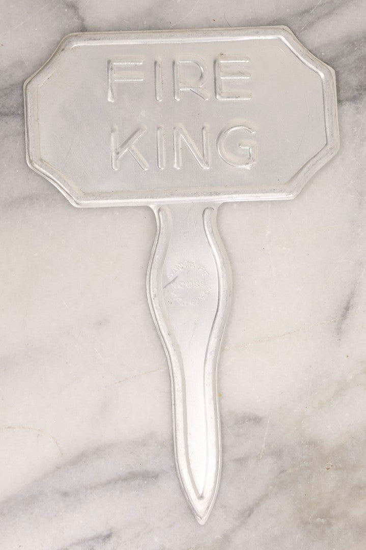 Lot 275 - Grouping Of Six Vintage Metal Objects Including Fire King Aluminum Rose Garden Marker, Cast Iron Meat Tenderizer, Schrader Tire Pressure Gauge, Lucky Dime Register Bank, Esterbrook Clip, And Mechanics Pal Tape Measure