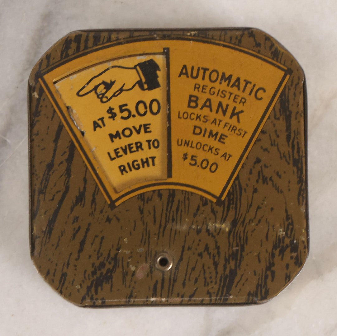 Lot 275 - Grouping Of Six Vintage Metal Objects Including Fire King Aluminum Rose Garden Marker, Cast Iron Meat Tenderizer, Schrader Tire Pressure Gauge, Lucky Dime Register Bank, Esterbrook Clip, And Mechanics Pal Tape Measure