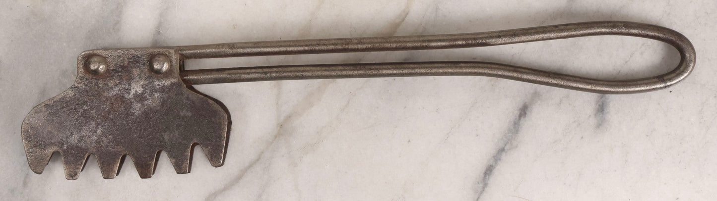 Lot 275 - Grouping Of Six Vintage Metal Objects Including Fire King Aluminum Rose Garden Marker, Cast Iron Meat Tenderizer, Schrader Tire Pressure Gauge, Lucky Dime Register Bank, Esterbrook Clip, And Mechanics Pal Tape Measure