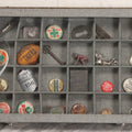 Lot 276 - Modern Display Case With Vintage Smalls And Advertising Pieces Including Candy Machine Door, Bicycle License, Pinback Buttons, Printing Block, And Metal Toy Football Player