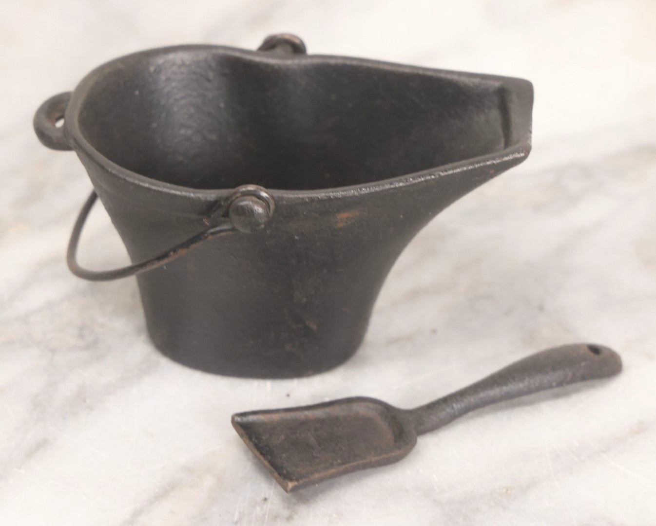 Lot 277 - Grouping Of Five Vintage Metal Vessels Including Bronze Smudge Pot, Brass Drum, Cast Iron Pan, And Ash Bucket With Scoop