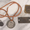 Lot 281 - Grouping Of Four Vintage Metal Badges Including St. Christopher Automobile Safety Badge, I.O.O.F.. Odd Fellows Badge, New Idea Product Tag, And Dog Rabies Tag