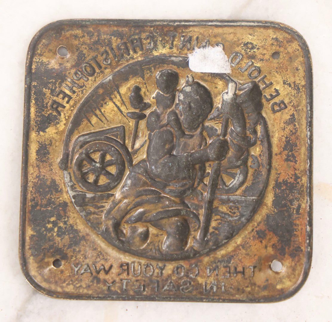 Lot 281 - Grouping Of Four Vintage Metal Badges Including St. Christopher Automobile Safety Badge, I.O.O.F.. Odd Fellows Badge, New Idea Product Tag, And Dog Rabies Tag