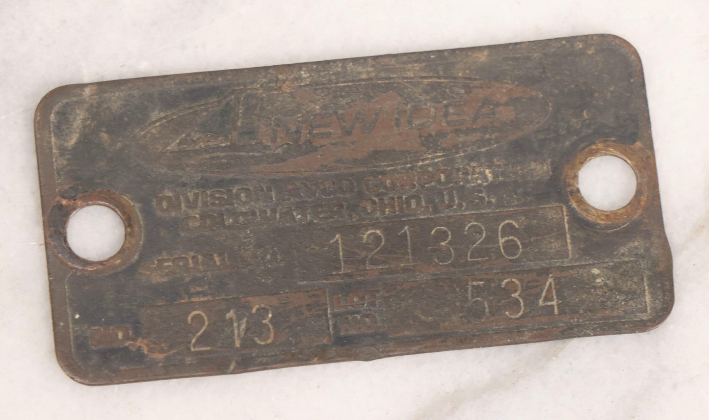 Lot 281 - Grouping Of Four Vintage Metal Badges Including St. Christopher Automobile Safety Badge, I.O.O.F.. Odd Fellows Badge, New Idea Product Tag, And Dog Rabies Tag