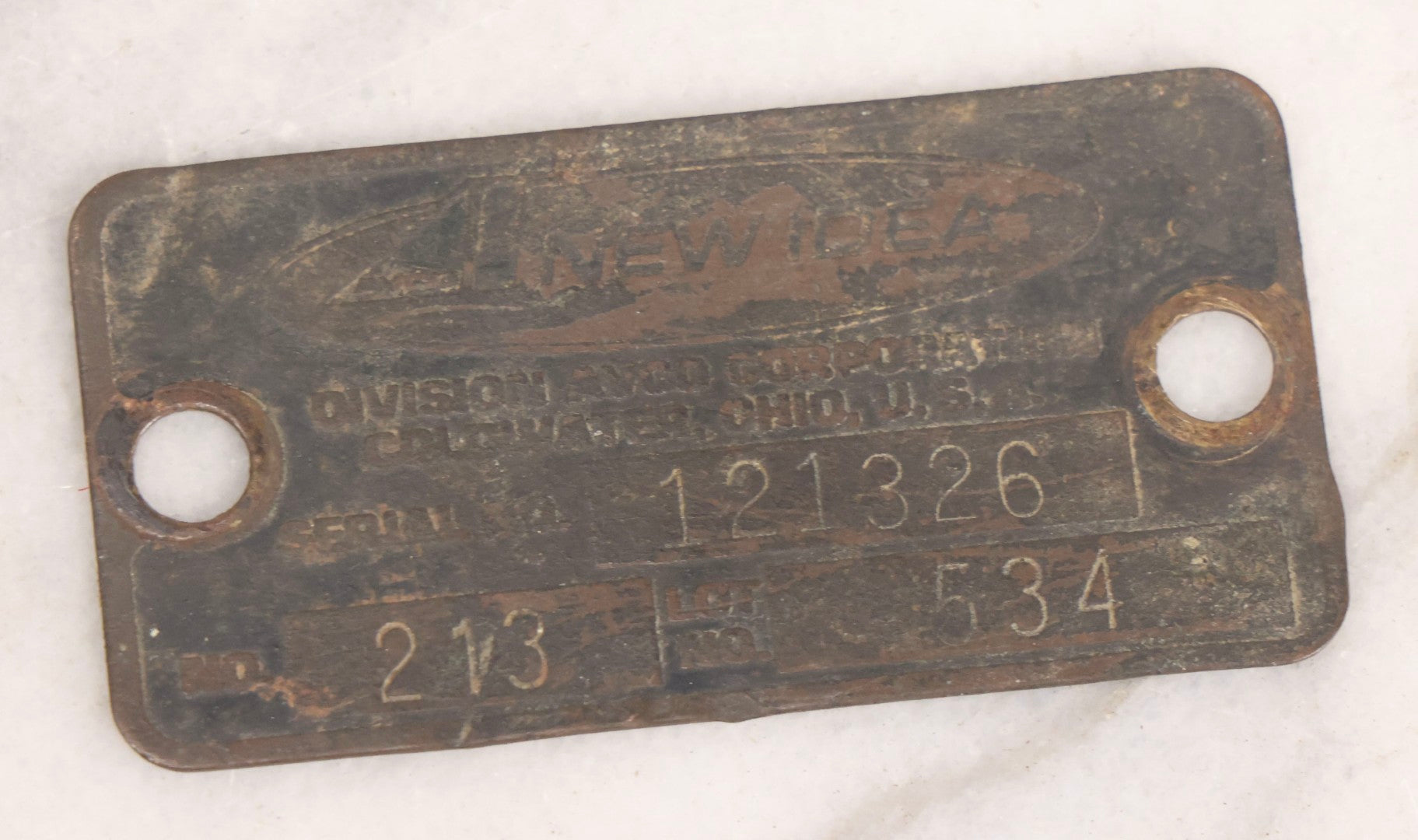 Lot 281 - Grouping Of Four Vintage Metal Badges Including St. Christopher Automobile Safety Badge, I.O.O.F.. Odd Fellows Badge, New Idea Product Tag, And Dog Rabies Tag