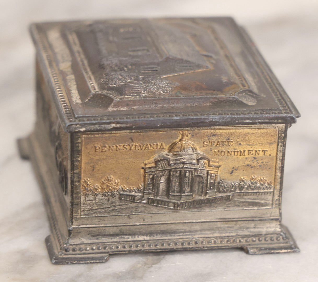 Lot 282 - Pair Of Vintage Metal Boxes Made In Japan Including Pennsylvania Landmarks Box By Bosselman & Co. And Peacock Design Box