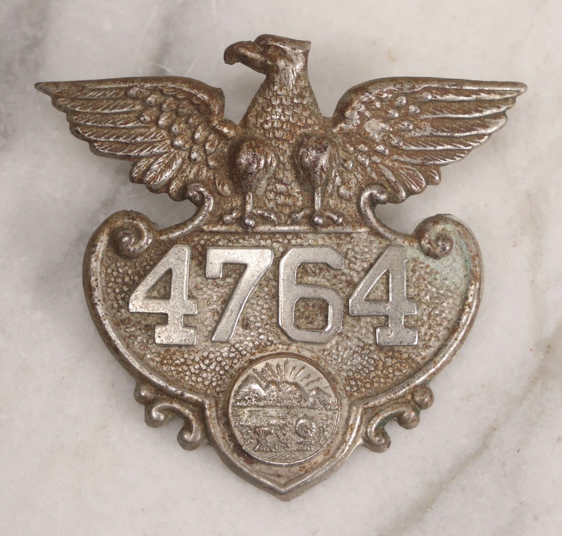 Lot 284 - Pair Of Vintage Ohio Police Patrolman's Standard Wreath Badges With Eagle Design, Numbered 4764 And 7723