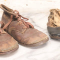 Lot 289 - Two Pairs Of Antique Leather Children's Shoes Including Brown High-Top Lace-Up Boots And Cream And Black High-Button Boots