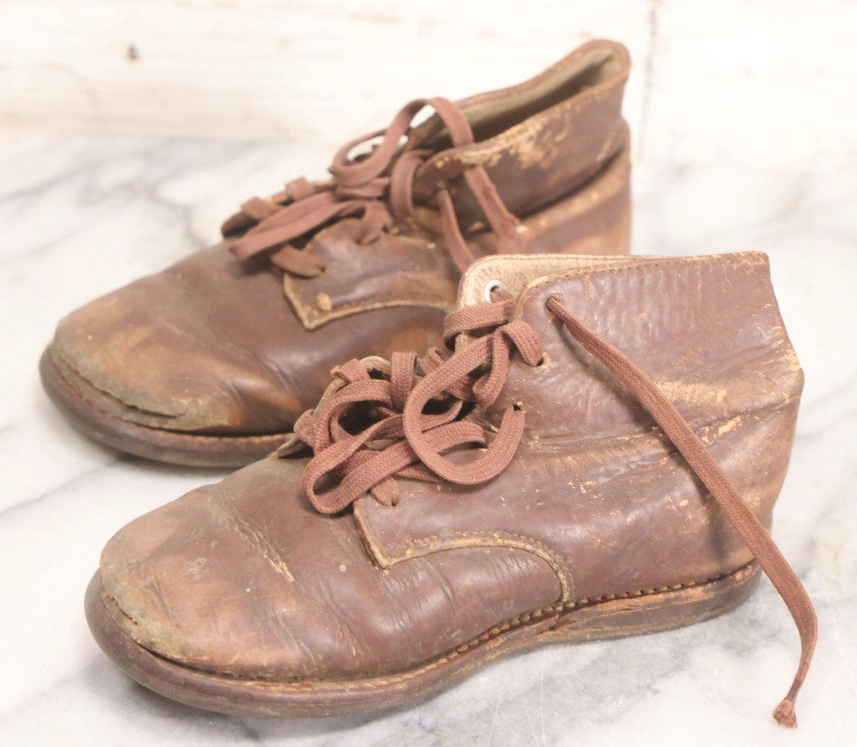Lot 289 - Two Pairs Of Antique Leather Children's Shoes Including Brown High-Top Lace-Up Boots And Cream And Black High-Button Boots