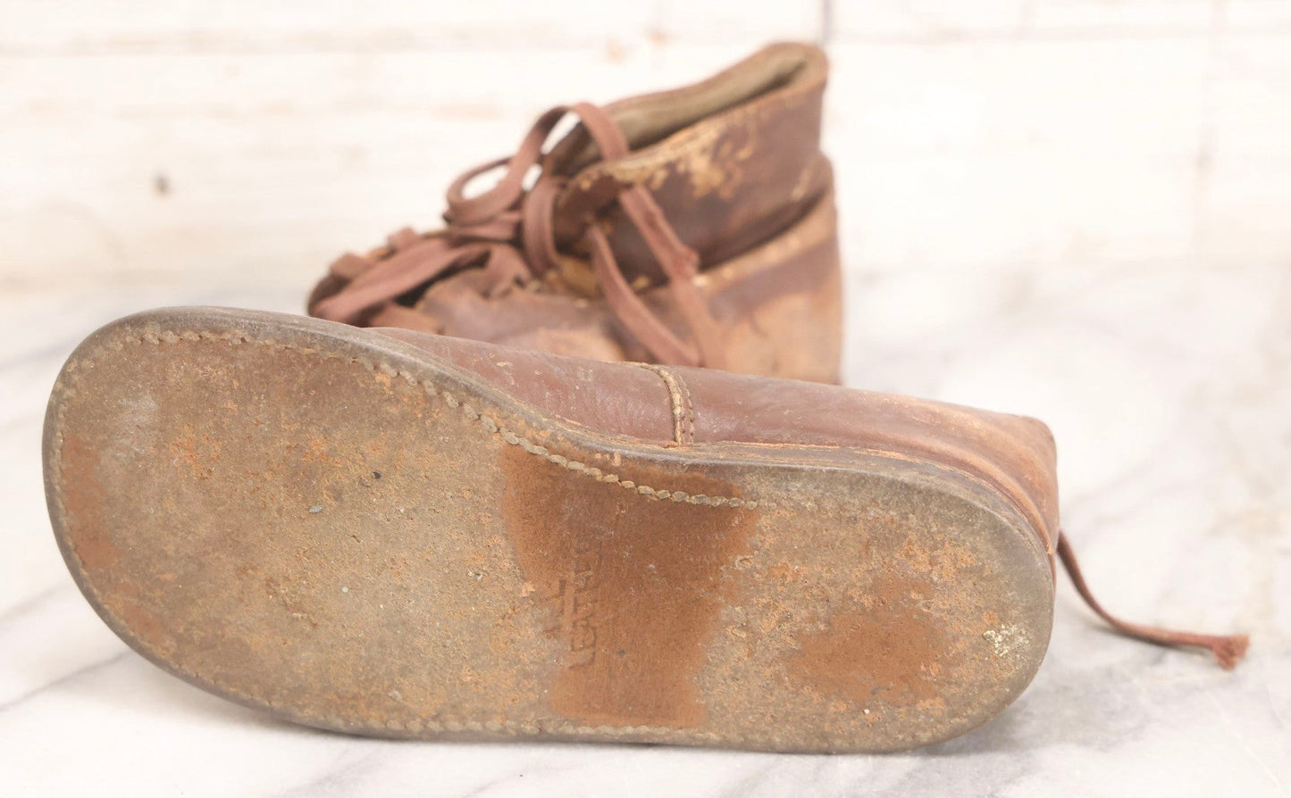 Lot 289 - Two Pairs Of Antique Leather Children's Shoes Including Brown High-Top Lace-Up Boots And Cream And Black High-Button Boots