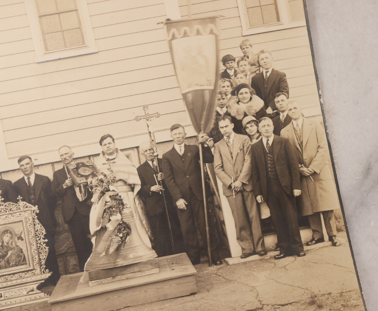 Lot 293 - Antique Unmounted Photograph Depicting Priest And Churchgoers Holding Banners Before Large Icon And Bell, Circa 1914, Handwritten Note On Verso Identifies Wasyl Pilch Holding Gospel, Founder Of St. Peter & Paul Church