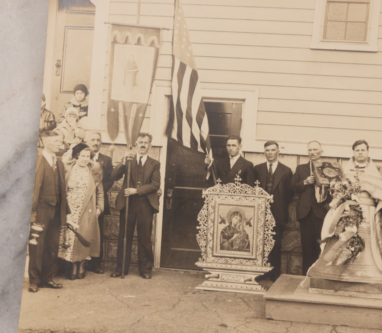 Lot 293 - Antique Unmounted Photograph Depicting Priest And Churchgoers Holding Banners Before Large Icon And Bell, Circa 1914, Handwritten Note On Verso Identifies Wasyl Pilch Holding Gospel, Founder Of St. Peter & Paul Church