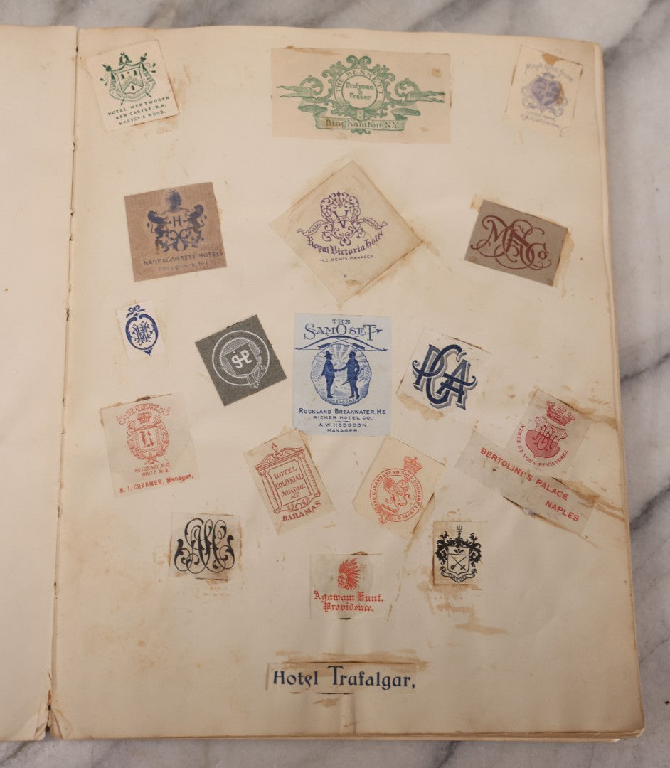 Lot 294 - Antique Scrapbook With Clipped Logos, Seals, And Institutional Names From Colleges, Hotels, Clubs, Banks, Government Offices, And More, Arranged By Color Throughout 20+ Pages, Marbled Cover Boards