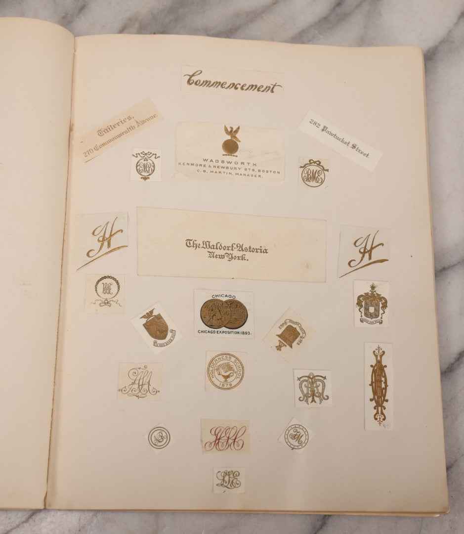 Lot 294 - Antique Scrapbook With Clipped Logos, Seals, And Institutional Names From Colleges, Hotels, Clubs, Banks, Government Offices, And More, Arranged By Color Throughout 20+ Pages, Marbled Cover Boards