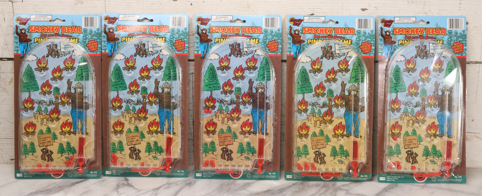 Lot 306 - Grouping Of Five Modern Smokey Bear Pinball Games, Licensed Forest Fire Prevention Educational Toys, Gordy International, Plainfield, New Jersey