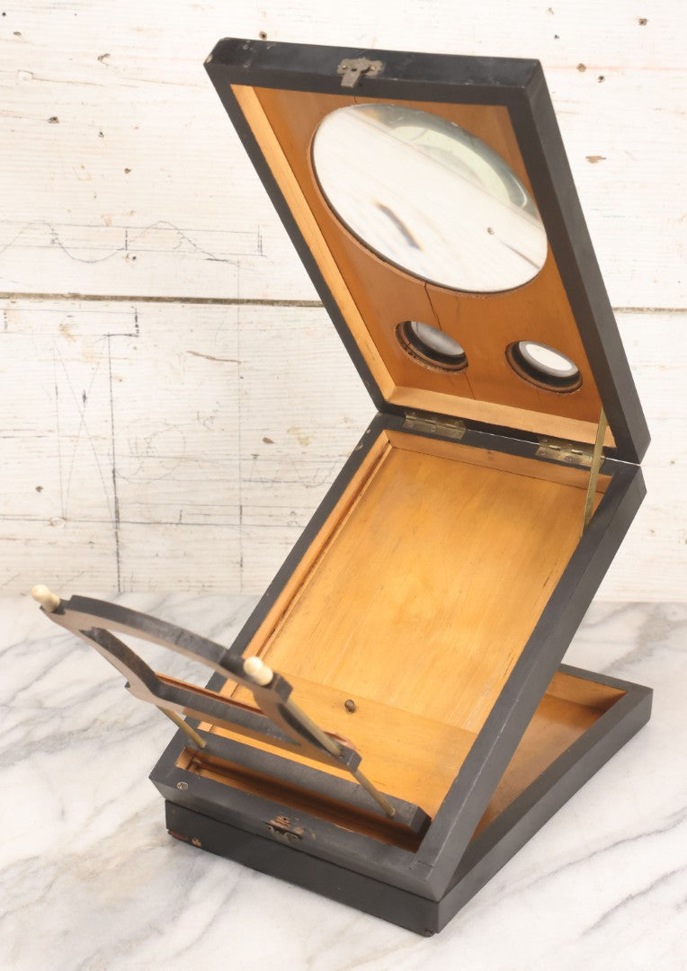 Lot 005 - Antique Black Lacquered Wooden Graphoscope Folding Table Top Stereo Card And Photograph Viewer "Souvenir De Paris", Note Center Lens Has Chip, 6-7/8" x 10-3/4"