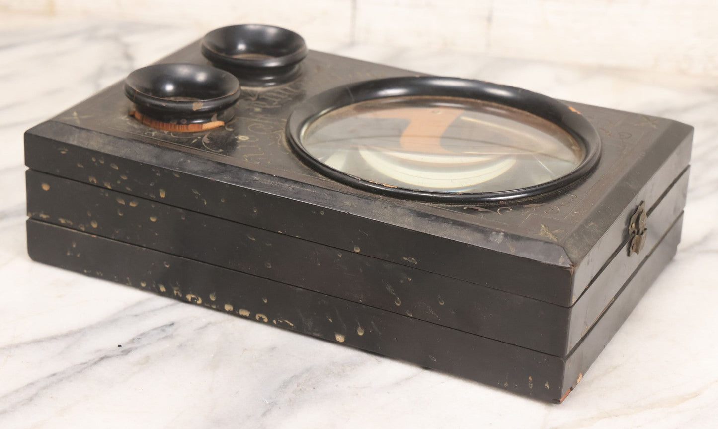 Lot 005 - Antique Black Lacquered Wooden Graphoscope Folding Table Top Stereo Card And Photograph Viewer "Souvenir De Paris", Note Center Lens Has Chip, 6-7/8" x 10-3/4"