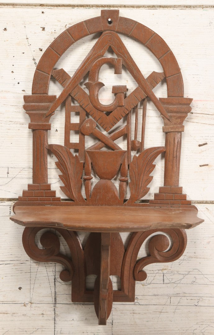 Lot 010 - Vintage Carved Wooden Masonic Folding Wall Shelf With Square And Compass, Columns, Arch, And Acanthus Leaf Motifs, 11-1/4" x 19"