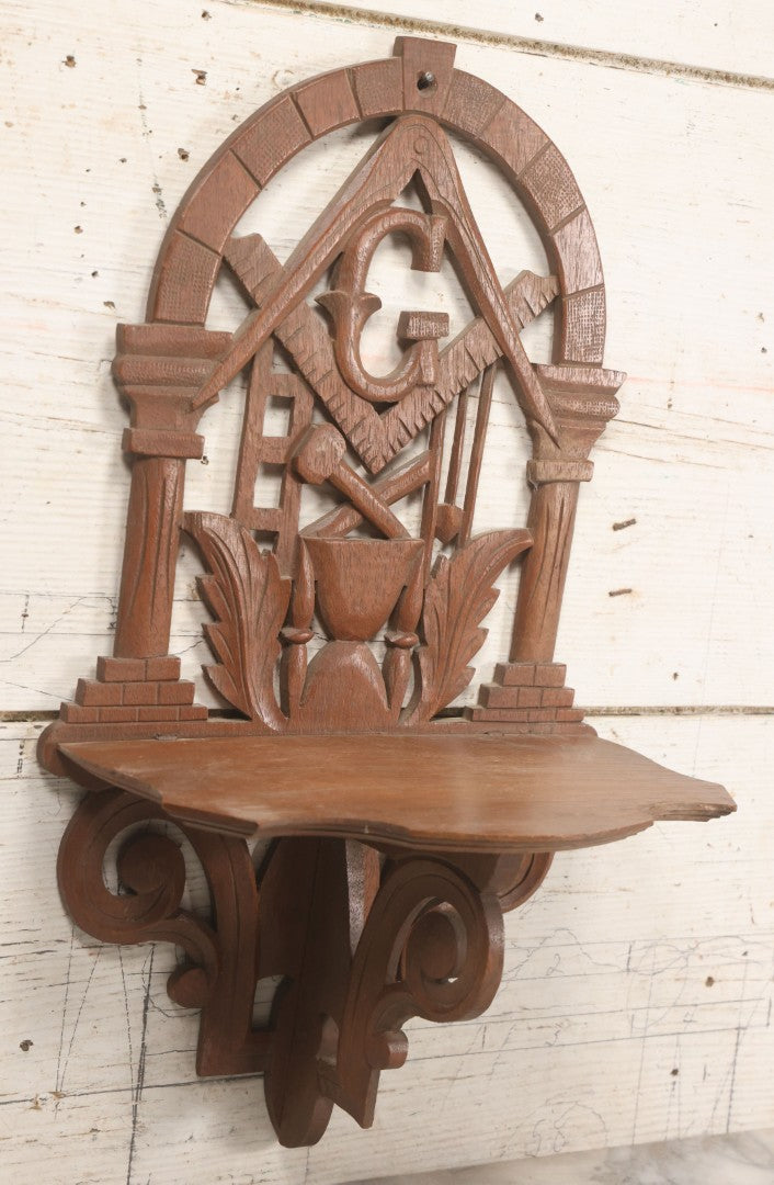Lot 010 - Vintage Carved Wooden Masonic Folding Wall Shelf With Square And Compass, Columns, Arch, And Acanthus Leaf Motifs, 11-1/4" x 19"