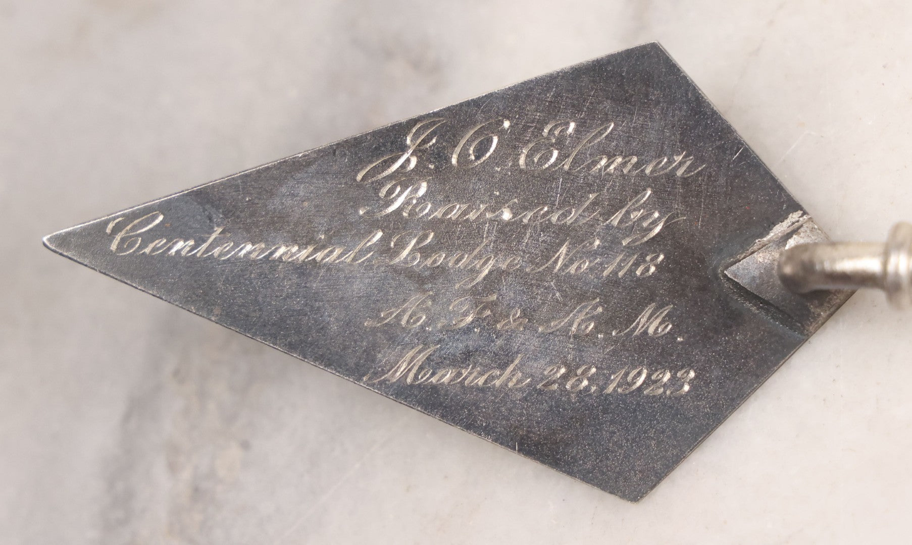 Lot 014 - Antique Miniature Masonic Commemorative Trowel With Metal Blade And Black Lacquered Wooden Handle, "J.C. Elmer Raised By Centennial Lodge No. 118 A.F & A.M. March 28, 1923," 4-1/2" W