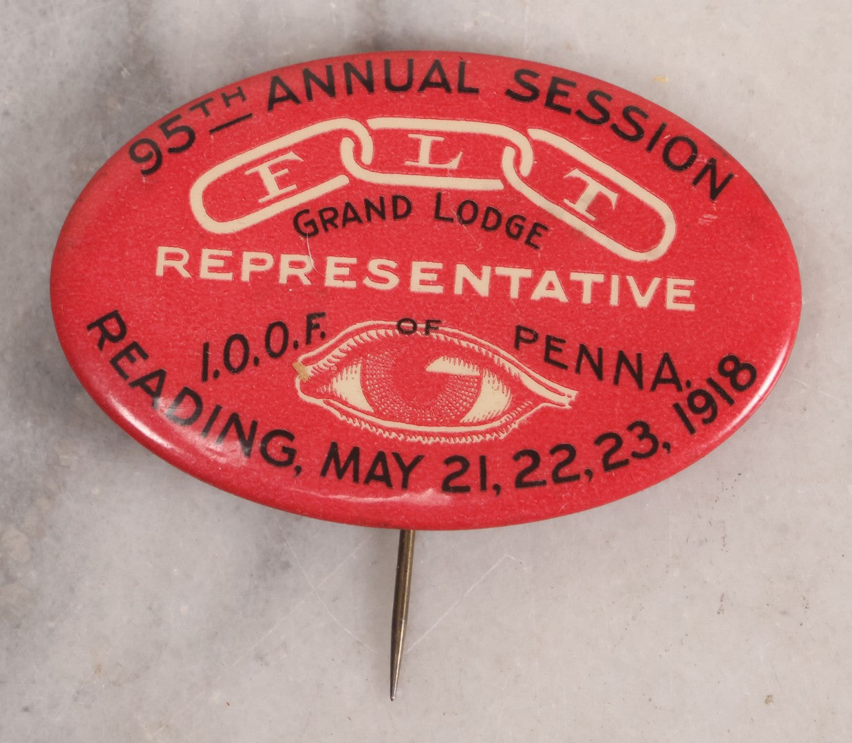 Lot 015 - Antique Red Pinback Button, Representative, 95th Annual Session Odd Fellows Grand Lodge, I.O.O.F. Of Pennsylvania, Reading, 1918 With F.L.T., Three Links, And All Seeing Eye Motifs, Manufactured By Keystone Badge Co., Reading, Pennsylvania
