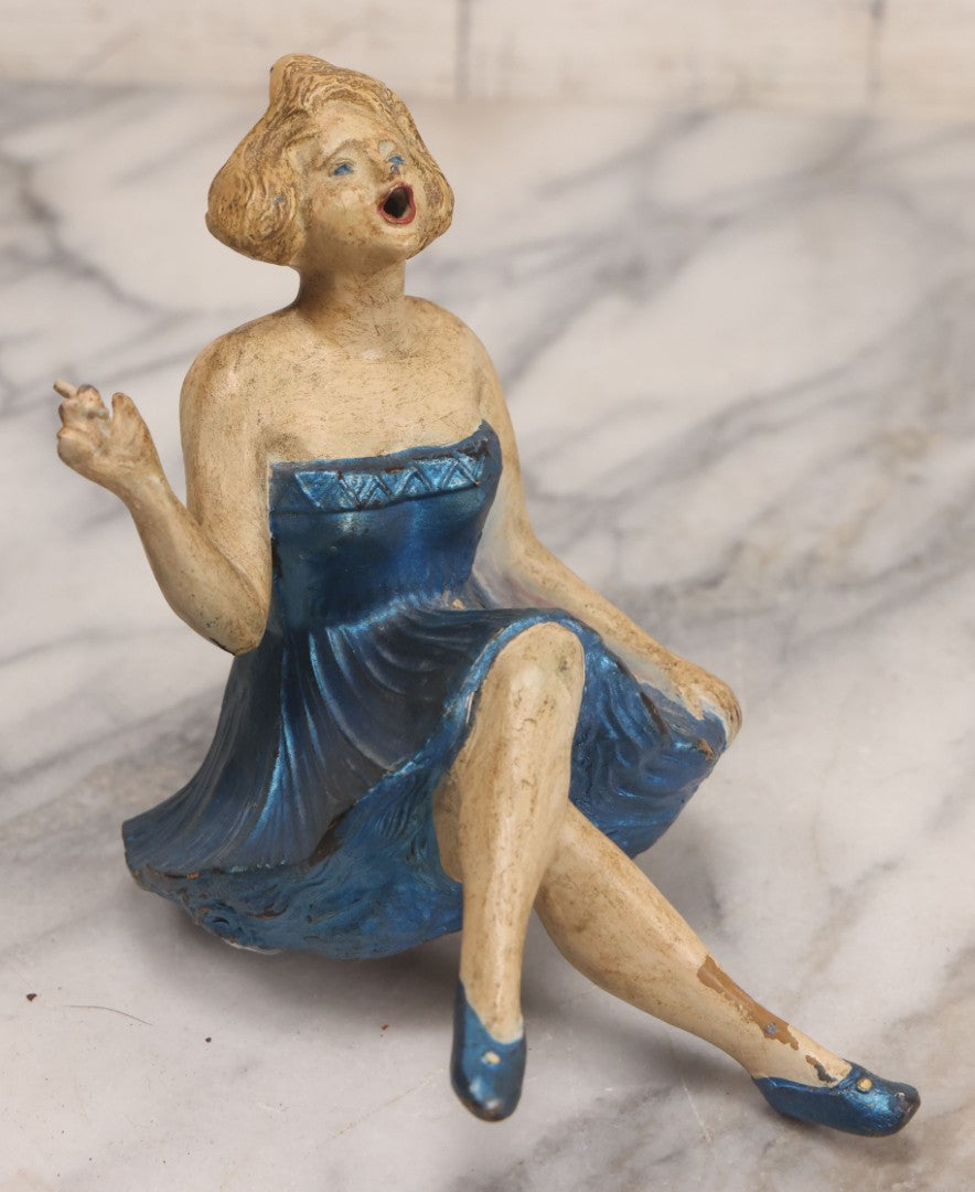 Lot 024 - Vintage Painted Cast White Metal Art Deco Incense Burner Depicting A Blonde Woman In Blue Dress Holding A Cigarette